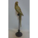 WITHDRAWN -A contemporary gilt resin model of a parrot on stand