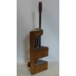 An antique wooden press