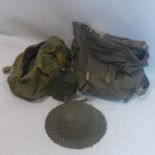 An Army canvas bag, with army helmet, water bottle and bag