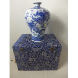 A Chinese, 20th century porcelain baluster vase handpainted in blue and white with writhing