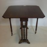 An Edwardian mahogany drop leaf table