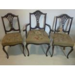 Three Edwardian mahogany dining chairs with tapestry seats