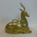 An early 20th century, Indian weighty brass lidded container in the form of a seated stag, 39 x 36 x