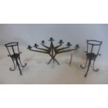 A brutalist candelabra together with 2 wrought iron candle holders