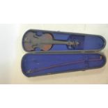 An antique violin with printed label inside, together with bow and hard case