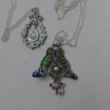 Two sterling silver pendants on silver chains: an Art Nouveau style example with plique a jour
