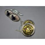 Two pairs of sterling silver cufflinks: one pair containing oval porcelain panels of pug dogs, the