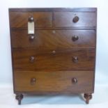 A Victorian mahogany chest of two short over three long drawers, raised on turned legs, H.105 W.88