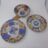 Two Japanese Imari plates, decorated with stylised flowers, Diameter 25cm; and cartouches of birds