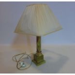 A 20th century onyx table lamp with shade, H.58cm