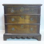 An 18th century oak chest of 3 drawers, with shaped apron raised on bracket feet, H.80 W.83 D.60cm