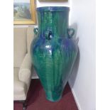 A pair of large Persian blue and green drip glazed Sharab wine vessels, H.135cm (2)