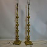 A pair of early 20th century ormolu standard lamps, H.131cm