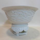 A large Chinese white ceramic bowl on stand, with dragon decoration, H.29 W.42cm