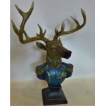 A resin stag in military uniform, raised on socle base, H.62 W.48cm