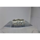 An 18ct white gold eternity ring allover pave-set with round, brilliant-cut diamonds (0.75 carats