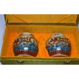 A pair of Chinese porcelain ginger jars and covers, with dragon decoration and set in presentation