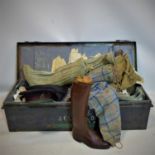 A late 19th/early 20th century metal trunk with contents including leather riding boots with