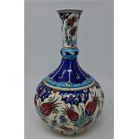 A Turkish Iznik vase, decorated with stylised flowers, H.20cm