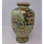 A Japanese satsuma style vase, decorated with vignettes of children playing in garden settings,