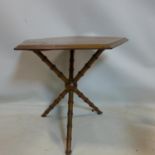 A Howard & Sons gypsy table with carved faux bamboo legs, H.65 W.71 D.70cm