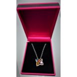 A boxed 14ct white gold pendant set with faceted sapphire, citrine, green and pink and amethyst