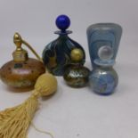 An Isle of Wight Glass perfume atomiser, together with three Isle of Wight glass perfume bottles