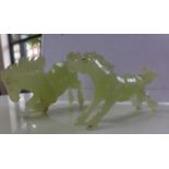 Two 20th century, Chinese carved green jade horses 6 x 12cm and 8 x 13cm