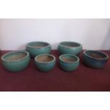 Two sets of three teal glazed pots, H.23cm Diameter 43cm (largest)