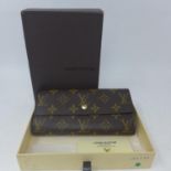 An unused, boxed leather monogrammed wallet by Louis Vuitton, H: 9 x W: 18 x D: 3cm, Product No: