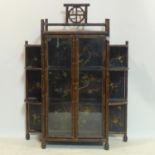 A Japanese bamboo lacquered cabinet, the lacquered panels gilt decorated with birds and insects on