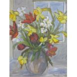 A framed mid-20th century oil on canvas of a still life arrangement of daffodils and red tulips,