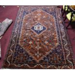 A Southwest Persian Qashqai carpet with central diamond medallion with repeating animal motifs and