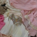 A collection of vintage clothing to include cotton blouses, a 1920's silk and lace bias-cut dress