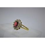 A 9ct yellow gold, faceted garnet and white sapphire cluster ring, Size: P 1/2, 2.2g