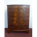 A figured mahogany bow fronted chest of 6 graduated drawers, on bracket feet, H.82 W.64 D.44cm