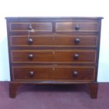 A Georgian inlaid mahogany chest of two short over two long drawers, raised on bracket feet, H.90