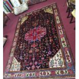 A Northwest Persian Nahawand carpet with central double pendant medallion with repeating petal