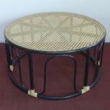 An ebonised circular coffee table, with caned top, H.40cm Diameter 84cm