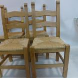 A set of 4 beech dining chairs with woven rush seats, H: 100 x W: 47cm