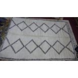 A Moroccan Berber Beni Mrirt rug, of double line diamond design, 326 x 219cm