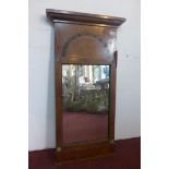 An Empire period inlaid and brass mounted mahogany pier mirror, with moulded cornice above