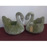 A pair of reconstituted stone swan planters, H.52 W.46 D.60cm