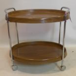 A two tier drinks trolley, raised on castors, H.63 W.64 D.43cm