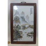 A Chinese porcelain plaque in hardwood frame, 53 x 30cm