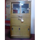 A 20th century beechwood collectors cabinet, with two sliding glazed doors above collectors drawers,