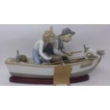 A large Lladro group figure, 'Fishing With Gramps' in 'Paloma', modelled by Jose Puche, marked to