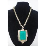 A cased, 18ct yellow gold plated necklace set to the centre with a large stepped cut emerald