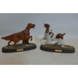 Two Royal Doulton hand-painted porcelain dogs on naturalistic oval plinth bases, both marked to