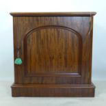 A Victorian mahogany side cabinet, with one cupboard door, on plinth base, H.72 W.70 D.42cm